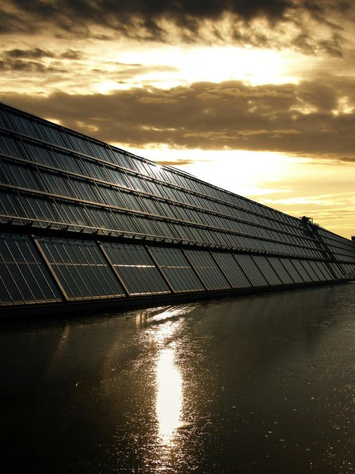 Solar panels next to a canal